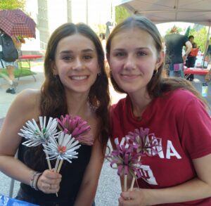 Making paper tube flowers at First Thursday