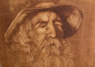 Charcoal sketch of an old man with a hat